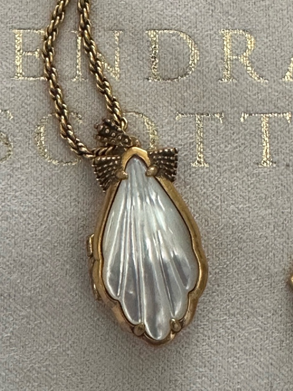 Kendra Scott Gold-Tone Mother of Pearl Shell Locket Necklace - Picture 7 of 7